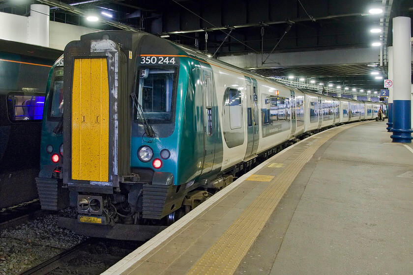 350244, LN 12.23 London Euston-Birmingham New street (1Y35, 1L), London Euston station 
 Our train home from London to Northampton sits in the gloom of Euston station. My wife and I travelled on a surprisingly quiet 12.23 service to Birmingham New Street worked by 350244 and another four-car set. Unusually, we had our tickets inspected by a pair of travelling revenue enforcement officers that makes a change as in our experience the 'train manager' (aka the guard) rarely checks tickets on London Northwestern services 
 Keywords: 350244 12.23 London Euston-Birmingham New street 1Y35 London Euston station London Northwestern Desiro