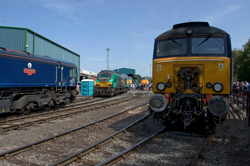 66303, 68006, 37425, 37419 & 57312, on display, Crewe Gresty Bridge 
 Except for 57312 (in the foreground), every one of the DRS locomotives seen in this photograph is named! On the extreme left, 66303 'Rail Riders 2020' is seen complete with a group trying to recruit new members on the other side of the locomotive. 68006 'Pride of the North' is next in line wearing its new green wrap livery stating 'Powering a Greener Britain'. This locomotive was formerly named 'Daring' with these plates put up for auction during the day but I cannot help but think that the penny-pinching vinyl plates applied to the side of the locomotive are a little disappointing. The two Class 37s are 37425 'Sir Robert McAlpine/Concrete Bob' and 37419 'Carl Haviland'. 
 Keywords: Rail Riders 2020 Pride of the North Daring Sir Robert McAlpine/Concrete Bob Carl Haviland 66303, 68006, 37425, 37419 57312 Crewe Gresty Bridge