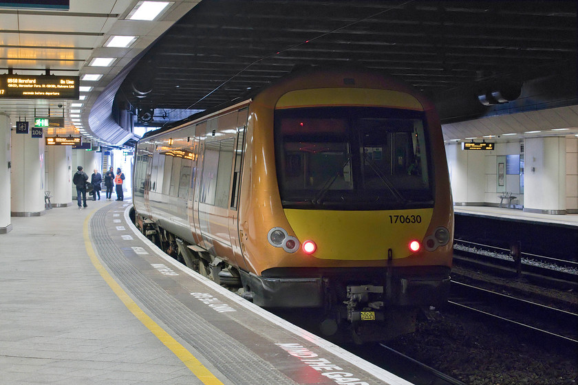 170630, LN 09.50 Birmingham New Street-Hereford (1V24, 1L), Birmingham New Street station 
 Looking smart in its West Midlands Trains livery, 170630 will leave Birmingham New Street's platform 10b with the 09.50 to Hereford. I have had to resort to a fair bit of Photoshop tinkering to present an acceptable photograph. Whilst the camera had got the exposure of the platforms about right, the rear of the unit, the roof and the trackbed was virtually completely black. Whilst these areas still remain dark, lightening up any more would result in the image looking too false; it's all about subtle adjustments! 
 Keywords: 170630 09.50 Birmingham New Street-Hereford 1V24 Birmingham New Street station