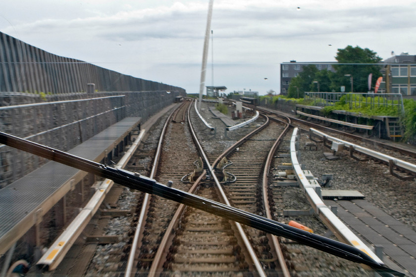 Rear view, B26, Lufthnaven-Vanlse working 
 Taken from the rear window of B26, one of Copenhagen Metro's units as it descends and enters the underground part of the network. My wife sone and I were travelling back from Lufthnaven to Christianshavn on an M2 Vanlse working. The Metro trains and stations were all immaculatly clean with a regular and offered good value service. 
 Keywords: Rear view B26, Lufthnaven-Vanlse workingCopenhagen Metro M2 line