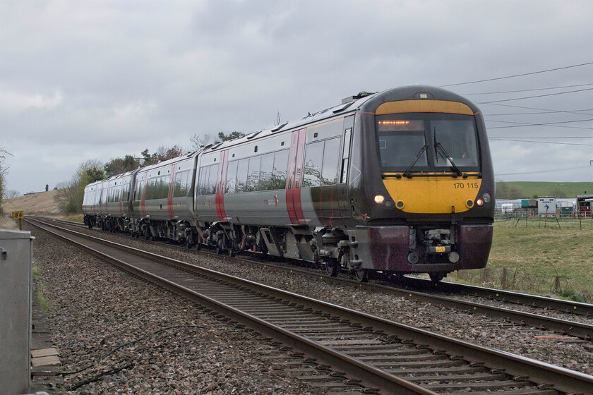 170115 & 170116, XC 07.04 Nottingham-Cardiff Central (1V04, RT), Brockhampton SO938262 
 Consecutively numbered 170115 and 170116 pass Brockhampton working the 07.04 Nottingham to Cardiff Central service. The large brown bank with the small tower-like structure to the extreme left is part of the huge Grundon operated landfill site that can often blights the area with unusual odours! 
 Keywords: 170115 170116 07.04 Nottingham-Cardiff Central 1V04 Brockhampton SO938262 CrossCountry XC