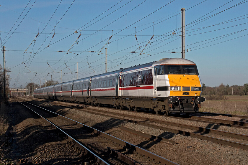 82214, GR 12.45 Leeds-London King's Cross (1A30, 6L), Holme Green crossing TL192426 
 Within a few minutes of the last up IC225 set another one was due to pass so despite really having to head home I decided to wait for 'just one more train'! DVT 82214 leads the 1A30 12.45 Leeds to King's Cross service past Holme Green foot crossing near Biggleswade. There are a number of level crossings within a short distance of this location but Holme Green is one of the easiest ones to photograph from behind the safety and security of fencing and gates. It is likely that they will all be abolished over the coming few years as Network Rail continues with its obsessive actions to remove them. 
 Keywords: 82214 12.45 Leeds-London King's Cross 1A30 6L Holme Green crossing IC225 DVT LNER