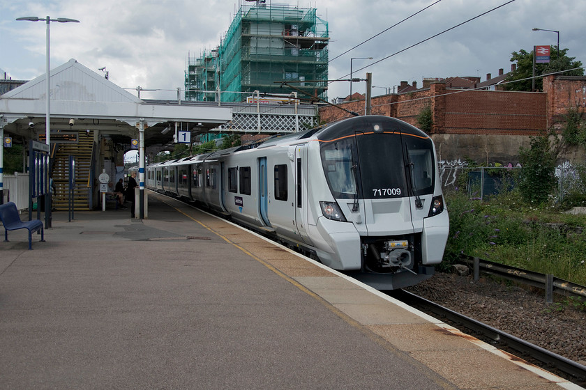 717009, GN 14.58 Welwyn Garden City-Moorgate (2K02, 1E), New Southgate station 
 717009 comes to a halt at New Southgate station forming the 14.58 Welwyn Garden City to Moorgate service. I took this train to its destination deep under London's streets. On arrival at Moorgate I was hoping to simply touch in on my Oyster card and get a Northern Line service to London Bridge. But, for some reason, the machines at platform level were all out of use so I had to ascend to concourse level pass the gateline with my NR ticket and then touch back in again on my Oyster to then descend to platform level again.....a little silly! All this had be done in a rush as it was fast approaching 16.00 and I was keen to touch in before the off-peak cut off. 
 Keywords: 717009 14.58 Welwyn Garden City-Moorgate 2K02 New Southgate station