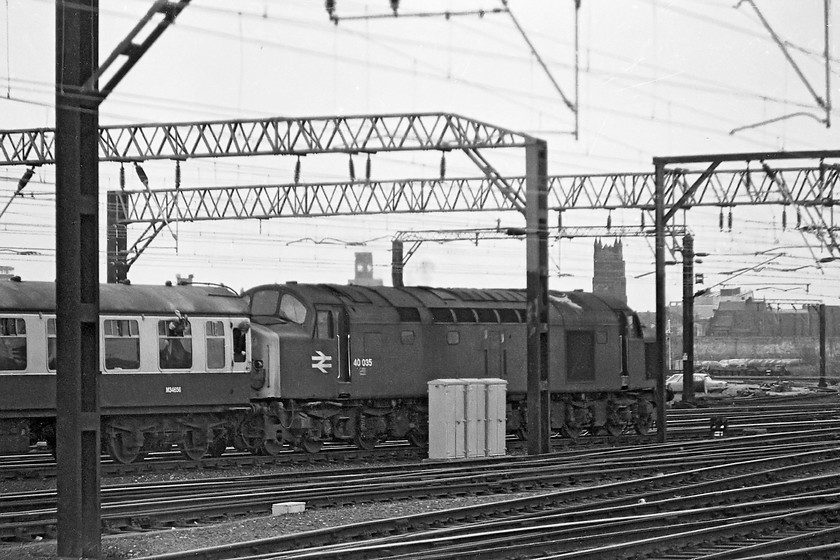 40035, unidentified down excursion, Crewe station 
 40035 leaves Crewe station with a northbound train. I have not been able to verify if this was a charter as I have it written in my note book from the day. The Class 40 Motherlist site has two observations of this train at Birmingham New Street and Stafford but with no detail, can anybody help? 
 Keywords: 40035 down excursion, Crewe station