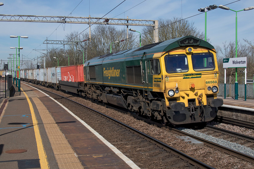 66566, 08.20 Birch Coppice-Felixstowe (2E), Wolverton station 
 66566 takes the steeply cambered up slow line at Wolverton station leading the well loaded 08.20 Birch Coppice to Felixstowe North Freightliner. It was quite noticeable that freights heading to the ports, like this one, were more heavily loaded than those coming away reflecting the lack of products arriving in the country due to the worldwide COVID-19 pandemic. 
 Keywords: 66566, 08.20 Birch Coppice-Felixstowe (2E), Wolverton station