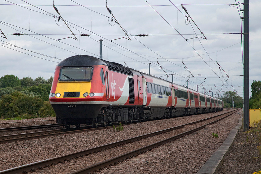 43318 & 43307, GR 05.26 Stirling-London Kings Cross (1E03, 1E), Offord DArcy TL213655 
 43318 leads with 43307 on the rear working the 05.26 1E03 Stirling to London King's Cross. The picture is taken from a little used foot crossing just south of Offord DArcy. Both these power cars have been Eastern Region units all their lives pounding up and down the ECML and still looking good! 
 Keywords: 43318 43307 1E03 Offord DArcy TL213655