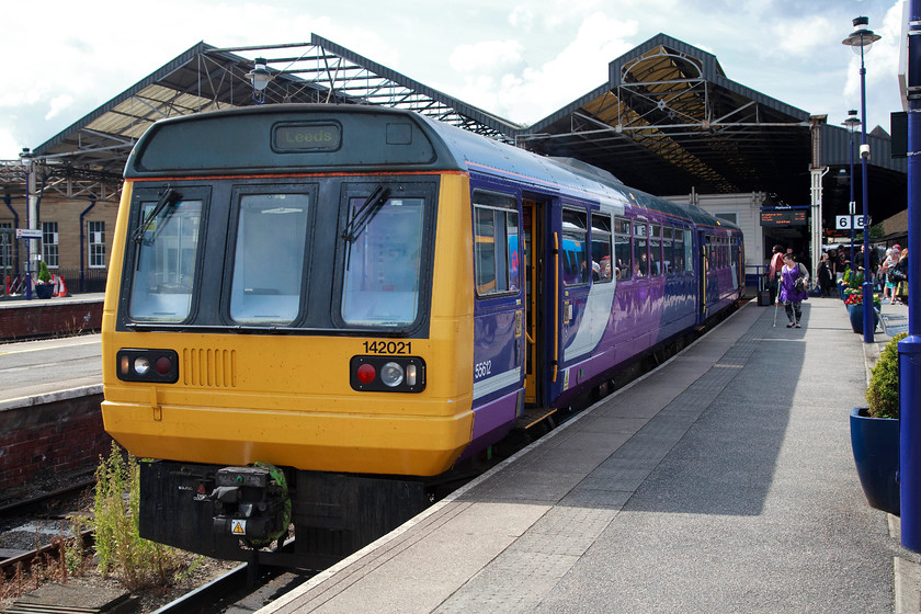 142021, NT 10.50 Huddersfield-Leeds (2W70, RT), Huddersfield station 
 This was my final train of the day that took me from Huddersfield to Halifax. 142021 is seen sitting in the bay platform with the 10.50 to Leeds. Even though I don't relish a trip on a Pacer, the experience will be one from the past soon so I always make a point of doing so when the situation arrises. 
 Keywords: 142021 2W70 Huddersfield station