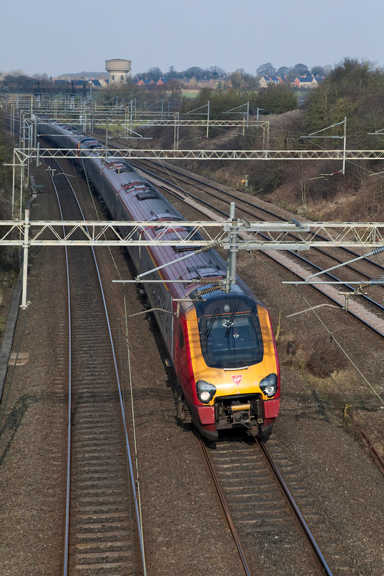 Class 221s, VT 08.18 Shrewsbury-London Euston (1B11, 4L), Victoria Bridge 
 Turning the previous way to the last photograph completely changes the lighting conditions! With one of Roade's characteristic water towers in full view two class 221 Voyagers race southwards forming the 1B11 08.18 Shrewsbury to London Euston. 
 Keywords: Class 221 Voyager 1B11 Victoria Bridge