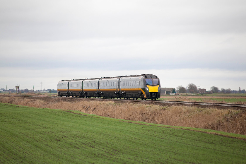 180103, GC 10.18 London Kings Cross-Hartlepool (1N90, RT), Three Horse Shoes no. 2 level crossing 
 180103 crosses the Fens approaching Three Horse Shoes no.2 level crossing forming the 10.18 King's Cross to Hartlepool. Notice how eleavated the line is as it crosses the flatlands of Cambridgeshire. 
 Keywords: 180103 10.18 London Kings Cross-Hartlepool 1N90 Three Horse Shoes no.2 level crossing.