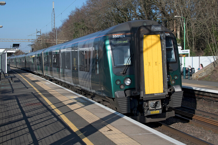 350124, LN 13.39 London Euston-Milton Keynes Central (2K33, RT), Kings Langley station 
 Having alighted from the 13.39 Euston to Milton Keynes service at Kings Langley I turned my camera to the rear of the train to capture it leaving. In full afternoon sunshine 350124 brings up the rear of the train that I had travelled from London on. 
 Keywords: 350124 13.39 London Euston-Milton Keynes Central 2K33 Kings Langley station London Northwestern Desiro