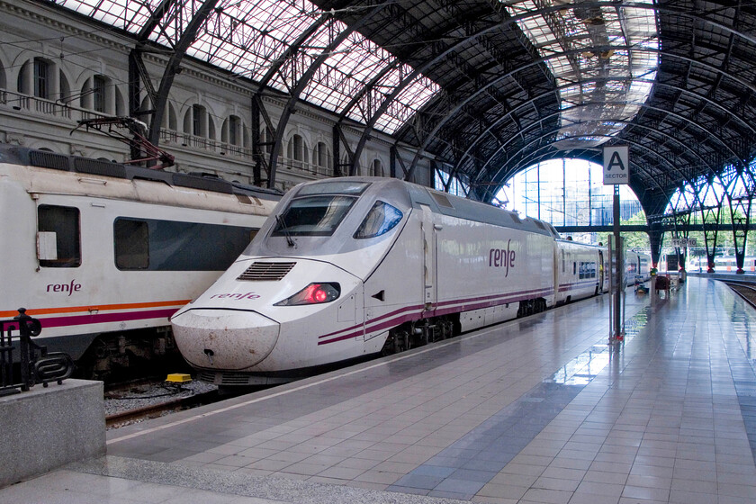 130 024, Renfe unidentified working, stabled, Barcelona Frana station 
 Under the grand curved trainshed of Barcelona Frana station Renfe 130 024 rests between services. Despite searching I was unable to ascertain what train it had worked in and what it was to work later. Notice the well-kept and highly polished platforms putting many UK stations to shame. 
 Keywords: 130 024 Renfe unidentified working, stabled Barcelona Frana station