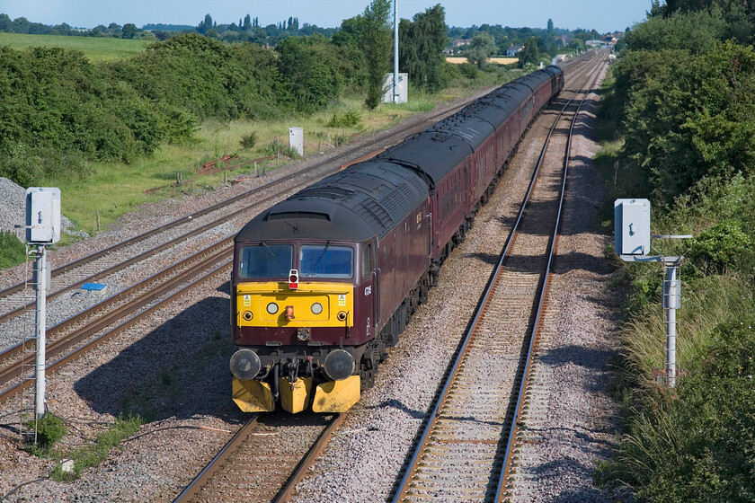 47245, outward leg of The Yorkshireman, 06.30 London Victoria-York (1Z82), Lower Farm Road, Bromham TL028518 
 Ambling along the down slow line a Bromham near Bedford 47245 brings up the rear of The Yorkshireman charter running as 1Z82 that had left Victoria at 06.30 with a destination of York. 70013 'Oliver Cromwell' is at the front leading the train that is waiting a for a green signal to pass on to the fast line at Sharnbrook Junction. 
 Keywords: 47245 The Yorkshireman 06.30 London Victoria-York 1Z82 Lower Farm Road, Bromham TL028518