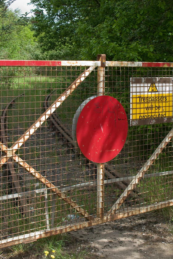 Former level crossing gates & track, Forge Lane, Horbury Junction 
 No wagons or rail vehicles have passed over this section of track for a number of years! This is one of the several lines that lead into the former Charles Roberts and Co Ltd wagon works located at Horbury Junction. After surviving into the 1970s the company, formed in 1862, was taken over by the Procor group and, subsequently, became part of Bombardier in 1990 finally closing in 2005. 
 Keywords: Former level crossing gates track, Forge Lane Horbury Junction