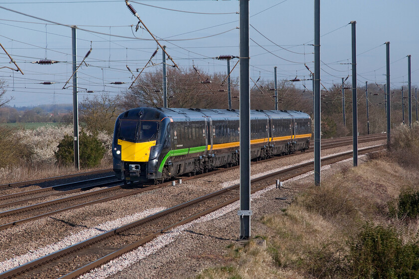 180112, GC 06.43 Sunderland-London King's Cross (1A60, 1L), Sandy TL176510 
 The 1A60 06.43 Sunderland to King's Cross Grand Central train approaches Sandy worked by 180112 'James Herriot'; the second named GC unit seen within ten minutes at this location! Notice the large green stripe that has appeared on the flank of the leading car of the unit. This has been applied to celebrate that it is powered exclusively by bio-fuel. I am not at all sure if this means that the whole train is so powered or if it is just the leading one; advise anybody? 
 Keywords: James Herriot 180112 06.43 Sunderland-London King's Cross 1A60 Sandy TL176510 Grand Central