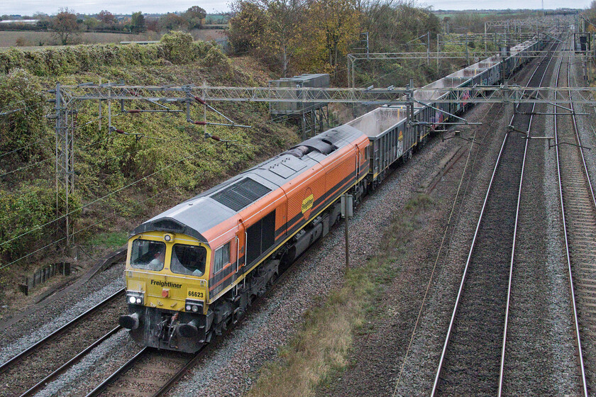 66623, 13.20 Willesden-Tunstead (6H50, RT), Victoria bridge 
 Freight two - 14.23 - 66623 wearing its rather work stained (on the front at least) Genesee & Wyoming livery leads the now daily 13.20 Willesden to Tunstead empty stone train running as 6H50. 
 Keywords: 66623 13.20 Willesden-Tunstead 6H50 Victoria bridge Freightliner 
Genesee & Wyoming