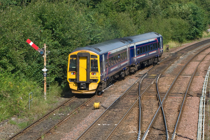 158730, SR 11.17 Dunblane-Dunblane ecs (5P36), Dunblane 
 A final photograph of 158730 as it passes the down passenger loop (home 2) DB42 semaphore that has permitted the ecs move to join the down main from the station loop. Once clear of the junction it will pass the ground disk signal that is seen just in front of the train and then pause while the driver changes ends. Once the disk signal is pulled off he will be able to negotiate the crossover and join the up main to re-enter the station again. All these moves are controlled by the signal box out of sight to my immediate right. 
 Keywords: 158730 11.17 Dunblane-Dunblane ecs 5P36 Dunblane station ScotRail Empty coaching stock Super Sprinter