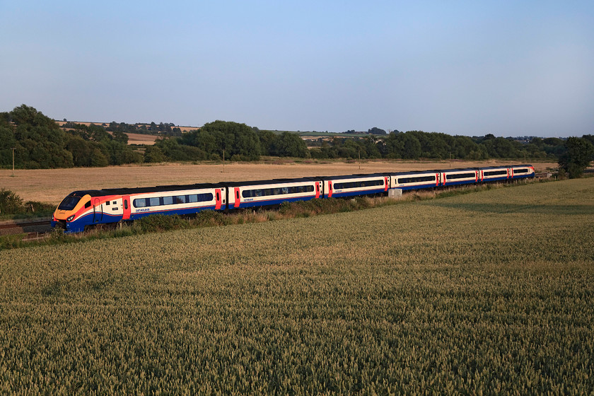 222003, EM 18.57 London St. Pancras-Sheffield (1F65, 5L), Harrowden Junction 
 222003 'Tornado' forms the 18.57 St. Pancras to Sheffield past Harrowden Junction. The sun has got very low in the sky now and picks out lots of detail including the Meridian's small vinyl nameplate (for want of a better name!) on the first carriage. 
 Keywords: 222003 1F65 Harrowden Junction