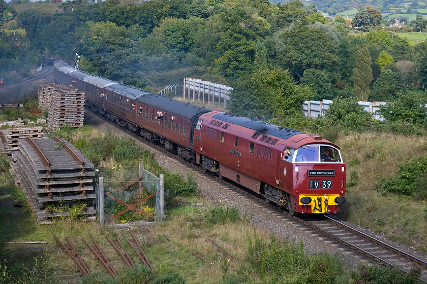 D1062, 10.30 Bridgnorth-Kidderminster, Bewdley South Junction SO799749 
 Taken from a superb vantage point but one, unfortunately, blighted by the storage of track panels, sees D1062 'Western Courier' getting away from Bewdley with the 10.30 Bridgnorth to Kidderminster train. This location is known as Bewdley South Junction and marks the spot where the former Stourport-on-Severn route diverged to the left (in this view). The driver of D1062 was driving extremely cautiously on the approach but just prior to the shutter being pressed opened up the twin Maybachs and roared past the spot with a blow of the horn.

There is an audio recording of this event on my youtube channel, see.... https://youtu.be/aR5Zsev3R-U 
 Keywords: D1062 10.30 Bridgnorth-Kidderminster Bewdley South Junction SO799749 Western Courier The Devonion