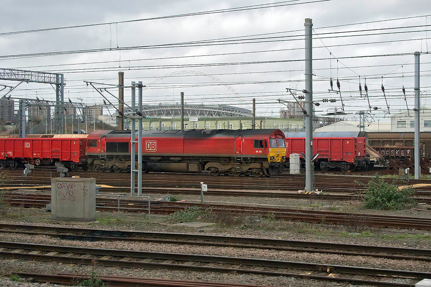 66167, stabled after working 18.15 ThO Bow-Wembley yard (6M05), Wembley yard 
 66167 stands in Wembley Yard at the head of some ballast wagons. Mike, who has access to TOPS, tells me that this Class 66 arrived leading the 18.15 Bow to Wembley Yard on Thursday. It then sat in the yard until Tuesday (over two days after this picture was taken) leaving as 6C91 to Tilbury. 
 Keywords: 66167 18.15 Bow-Wembley yard 6M05 Wembley yard having worked the 18.15 Bow to Wembley yard 6M05 two days previously. According to TOPS, it would then work forward on the 6C91 Freighliner to Tilbury on Tuesday morning. Thanks to Mike for the information on this as he has access to TOPS and can identify movements such as this.