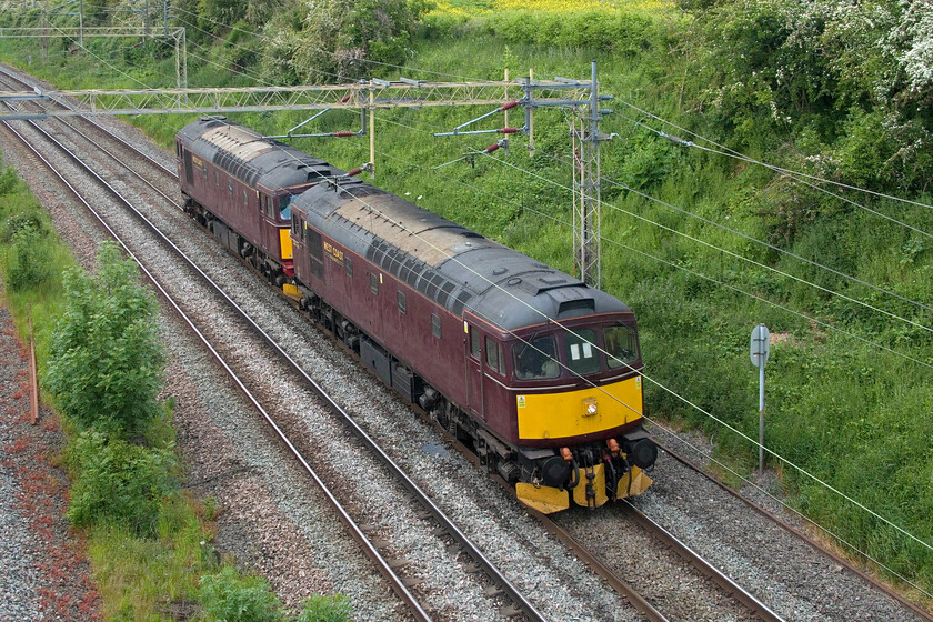 33025 & 33029, 15.30 Burton-ot-Wetmore-Southall WCR (0Z29, 95E), Victoria bridge 
 Despite being caught behind the extremely late running 4L48 teso Express (captured in the previous photograph) the 0Z29 15.30 Burton-ot-Wetmore to Southall WCR still managed to arrive an hour and a half early! 33025 and 33029 do not look great in their WCR livery being rather drab and I always fail to produce a reasonable photograph of them whatever the weather conditions. I photographed the leading Class 33 back in 1980, see.... https://www.ontheupfast.com/p/21936chg/29805504204/x33025-bristol-temple-meads-cardiff 
 Keywords: 33025 33029 15.30 Burton-ot-Wetmore-Southall WCR 0Z29 Victoria bridge WCR West Coast