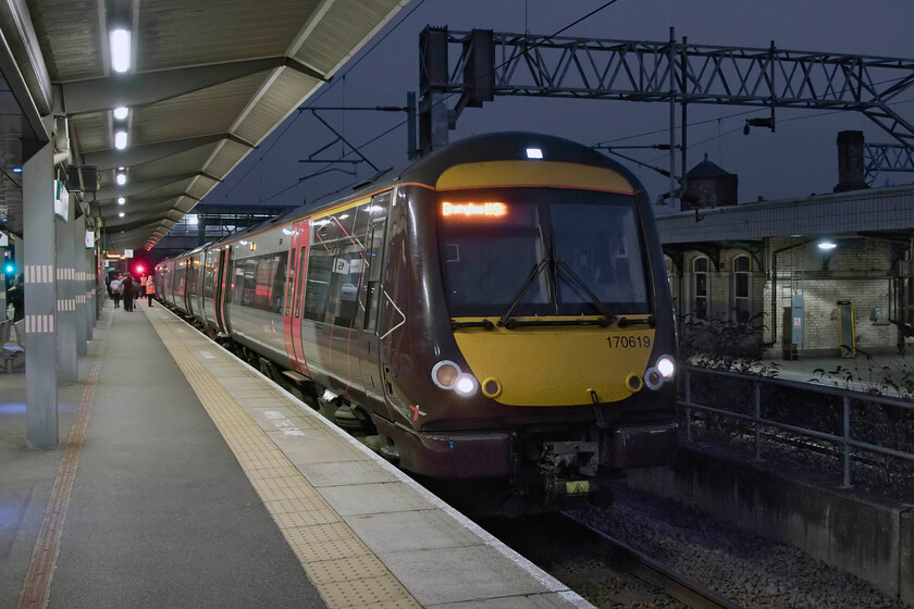 170619, XC 18.18 Leicester-Birmingham New Street (1P26, 4L), Nuneaton station 
 Having completed the final leg of our East Midlands Day Ranger in the almost darkness at Nuneaton I turned my camera towards the train and using its night photography settings I captured 170619 waiting to depart with the 18.18 Leicester to Birmingham New Street service. Due to some sort of engineering works between Syston and Peterborough many CrossCountry services on this route were terminating and starting from Leicester (such as this one) with a long and no doubt unpleasant bus journey for passengers east of there. I have to say that this was not well advertised and had quite an effect on our plans earlier in the day. 
 Keywords: 170619 18.18 Leicester-Birmingham New Street 1P26 Nuneaton station EMR East Midlands Railway Turbo