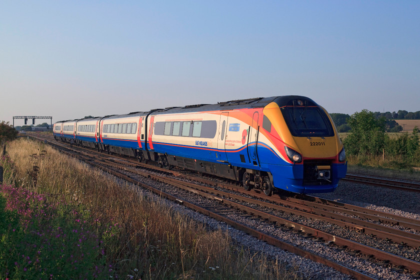 222011, EM 18.05 Nottingham-London St. Pancras (1B71, 3L), Harrowden Junction 
 In lovely evening sun, 222011 'Sheffield City Battalion 1914-1918' crosses Harrowden Junction working the 18.05 Nottingham to London St. Pancras. Before anybody complains, I am standing in a safe and perfectly legal position where the fence does a short dogleg to go under the bridge directly behind me. 
 Keywords: 222011 1B71 Harrowden Junction