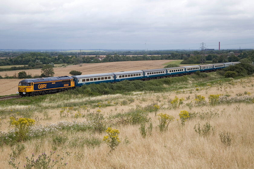 68008, outward leg of The Cappagh Capital Campaigner, 05.54 Derby-Chessington South (1Z50, 6E), Lidlington SP978384 
 Looking very smart adorned with its retro. speed whiskers 69008 'Richard Howe' (formally 56038) leads the 1Z50 Cappagh Capital Campaigner charter through the Marston vale at Lidlington between Bedford and Bletchley. Leaving Derby at 05.54 the Branch Line Society charter was to take in all sorts of rare and unusual sections of track on its return journey to Chessington South. Unfortunately for Andy, he failed to capture the scene as he experienced a technical fault with his camera caused by a faulty lens. 
 Keywords: 68008 The Cappagh Capital Campaigner 05.54 Derby-Chessington South 1Z50 Lidlington SP978384 Richard Howe