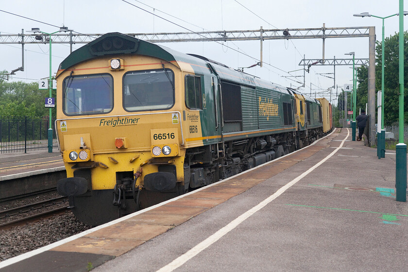 66516 & 66416, 03.25 Garston-London Gateway (4L52, 2E), Wolverton station 
 Failure or logistics? Running to time the 4L52 03.25 Garston to London Gateway passes at speed through Wolverton station led by 66516 and 66416. I am not at all sure if 66416 was being dragged due to failure or if it was part of a move to position the locomotive rather than simply run it as a light engine that makes sense. 
 Keywords: 66516 66416, 03.25 Garston-London Gateway 4L52 Wolverton station Freightliner