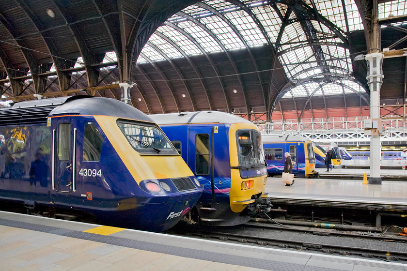 43094, GW 13.30 London Paddington-Bristol Temple Meads, Class 165s, Class 180 & Class 332, London Paddington station 
 A typically Great Western scene at Paddington station finds a number of different classes of train waiting on the blocks. In the foreground, at platform one, is 43094 that will soon work the 13.30 to Bristol Temple Meads adjacent to a Turbo unit with another example on platform four. Beyond that is Class 180 Adelante keeping the best tradition of the Western Region alive with their hydraulic transmission and dubious reliability! Finally, beyond that is a Heathrow Express Class 332 and another HST. 
 Keywords: 43094 13.30 London Paddington-Bristol Temple Meads class 180 class 165 Class 332 London Paddington station GW Great Western HST Adelante