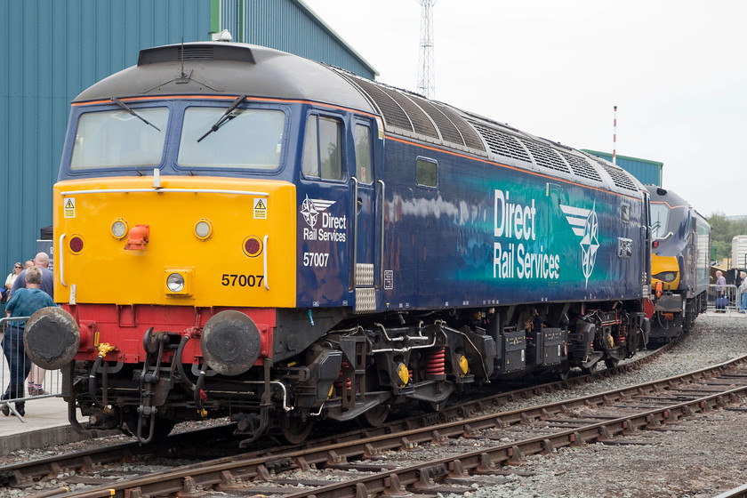 57007 & 88002, on-display, DRS Open Day, Gresty Bridge 
 Awaiting the naming ceromony later in the afternnon, 57007 looks smart in it revised DRS compass logo at the Gresty Bridge Open day. It was later to be named 'John Scott 12.5.45-22.5.12' after the late DRS Kingmoor employee. The new order in the form of 88002 'Prometheus' stands behind 57007. 
 Keywords: 57007 88002 DRS Open Day Gresty Bridge