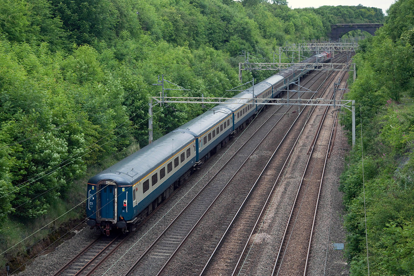 67010 & 67030 & stock, 08.30 London Paddington-Burton-Ot-Wetmore ECS (5Z51), Hyde Road Bridge 
 Out of site at the front of a retro. set of stock are 67010 and 67030. The train was the 08.30 Paddington to Burton-Ot-Wetmore ECS working. It was nice to see a rake of blue and grey Mk.IIs making their way down the fast line of the WCML at Roade, where this picture was taken. 
 Keywords: 67010 67030 stock 08.30 London Paddington-Burton-Ot-Wetmore ECS 5Z51 Hyde Road Bridge