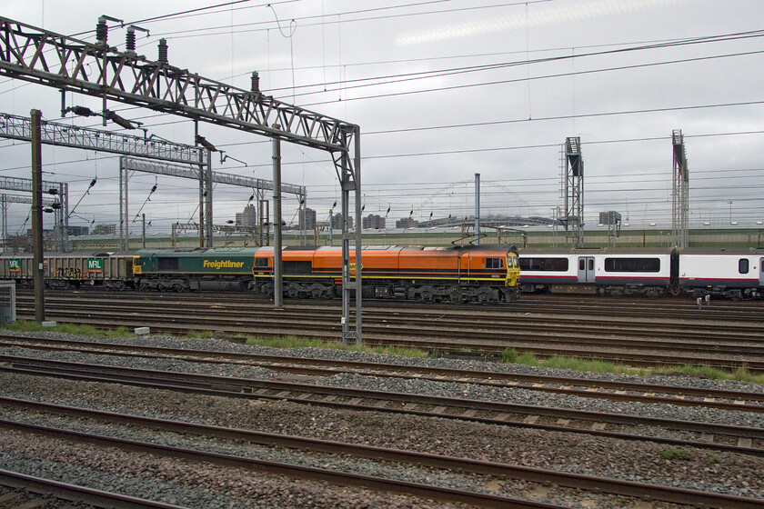 Class 66, 14.21 Wembley Yard-Merehead Quarry (7V50, 6L), 59203, stabled & 321309, stored, Wembley Yard 
 Unfortunately, despite many an effort the Freighliner Class 66 at the head of the 7V50 14,21 to Merehead sseen here sitting in Wembley Yard will remain unidentified! 59203 stabled in the foreground is more easily identified as is stored former Greater Anglia unit 321309 from its side number. 
 Keywords: Class 66 14.21 Wembley Yard-Merehead Quarry 7V50 59203 321309 Wembley Yard Freightliner