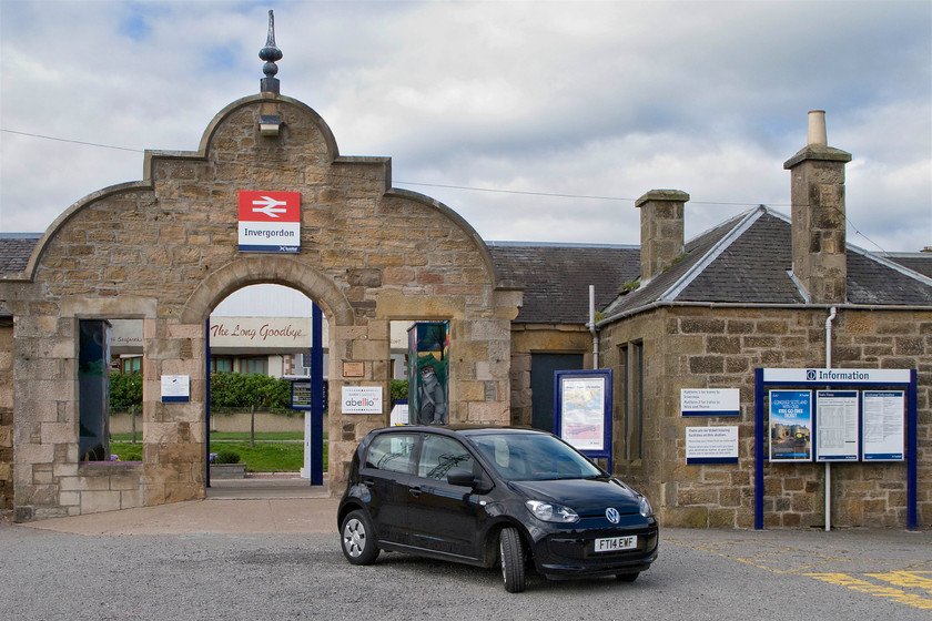 Frontage, Invergordon station 
 The rather impressive and well-maintained entrance to Invergordon station is seen with our VW Up! hire car parked in front. The station was opened by the Inverness and Ross-shire Railway in 1874 and is on the far north line to Turso and Wick. Whilst it has pretty healthy passenger numbers, in recent years these have been in a slow decline. 
 Keywords: Frontage, Invergordon station