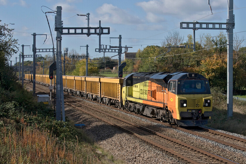 70813, 11.42 Westbury Down TC-Cliffe Hill Stud Farm (6M40, 100E), South Marston SU193869 
 The last time that I saw and photographed 70813 I was also with Andy but rather than here in Wiltshire we were in Nottinghamshire, see..... https://www.ontheupfast.com/p/21936chg/30024737870/x70813-10-21-doncaster-chs-bescot . The Colas locomotive is seen passing South Marston just east of Swindon leading the 6M40 11.42 Westbury Yard to Cliffe Hill (Leicestershire). The photograph is taken from a new footbridge installed as part of the GWML electrification that I have passed many times eyeing it from the nearby A420 but with limited parking, I have never actually been able to stop and visit it. 
 Keywords: 70813 11.42 Westbury Down TC-Cliffe Hill Stud Farm 6M40 South Marston SU193869 Colas Rail