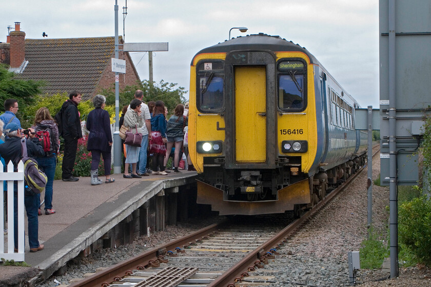 156416, LE 16.45 Norwich-Sheringham, Sheringham station 
 A busy scene at Sheringham's national network station sees passengers waiting to board 156416 'Saint Edmund' that will work the 16.45 service to Norwich. Looking at the number of passengers, who also stretched along the platform level with the train and behind me to the left begs the question as to whether a two-car unit is sufficient provision. 
 Keywords: Saint Edmund 156416 16.45 Norwich-Sheringham Sheringham station