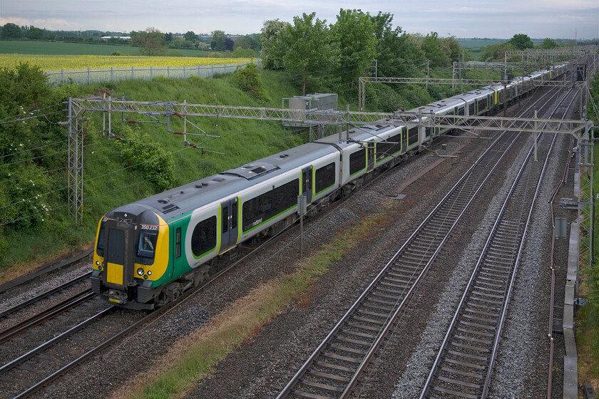 350242, 350245 & 350264, LM 17.13 London Euston-Birmingham New Street (1Y63), Victoria bridge 
 A number of London Midland's peak commuter trains are composed of three sets of class 350 Desiros to cater for the thousands of commuters who travel on the route north of London. The 1Y63 17.13 Euston to Birmingham is one of these trains that on this particular Friday evening is worked by 350242, 350245 and 350264 and is seen passing Victoria bridge just south of Roade. 
 Keywords: 350242 350245 350264 17.13 London Euston-Birmingham New Street 1Y63 Victoria bridge