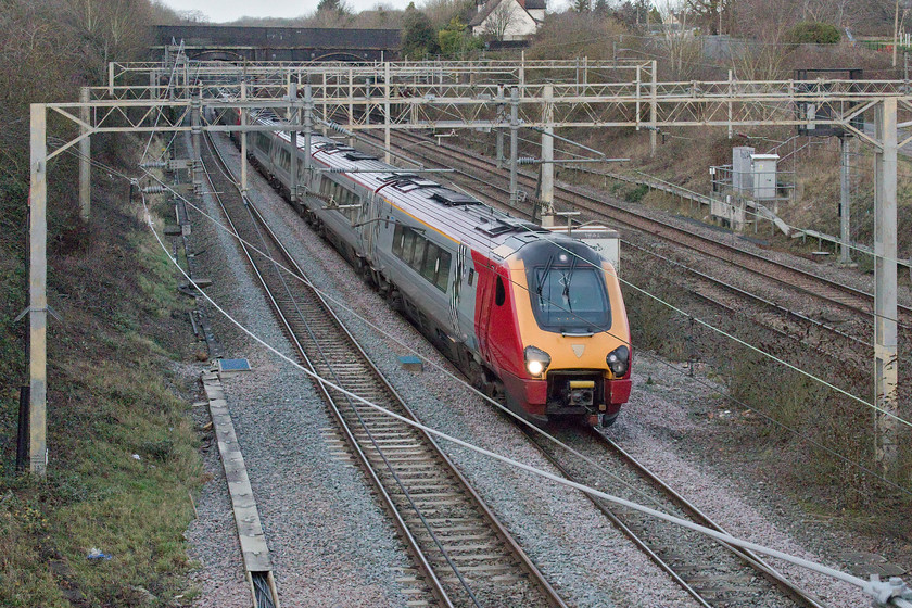 Class 221, VT 11.35 Chester-London Euston (1A28, 1E), site of Roade station 
 An unidentified class 221, still wearing the distinctive former Virgin Trains livery, passes the site of Roade station forming the 11.35 Chester to Euston service. I hope that when Avanti West Coast apply their livery and branding to these Voyagers that they make the set numbers a little more conspicuous than they are at present. 
 Keywords: Class 221, VT 11.35 Chester-London Euston (1A28, 1E), site of Roade station Voyager Avanti West Coast