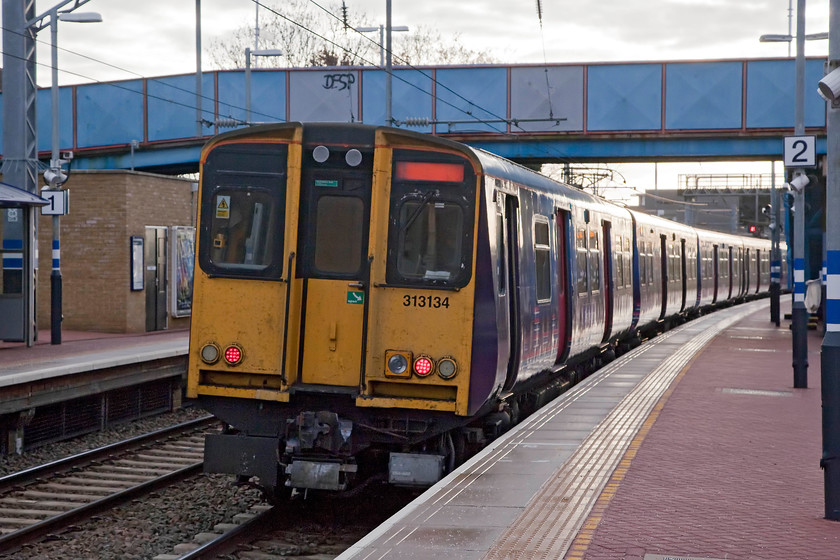 313134, GN 09.03 Welwyn Garden City-Moorgate (2K18), Alexandra Palace station 
 The rear of the 09.03 Welwyn Garden City to Moorgate Great Northern service leaves Alexandra station with 313134 on the rear. I had taken this train from Potters Bar but needed a change a Alexandra Palace in order to get back into King's Cross. 
 Keywords: 313134 09.03 Welwyn Garden City-Moorgate 2K18 Alexandra Palace station