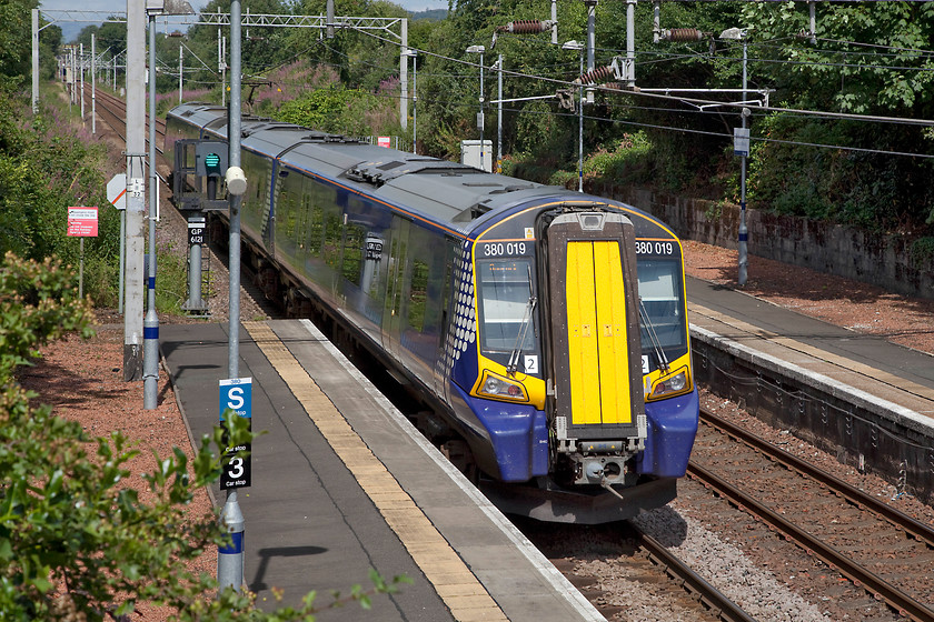 380019, SR 12.06 Glasgow Central-Gourock (2G63, 1E), Bishopton station 
 380019 leaves Bishopton station working the 2G63 12.06 Glasgow Central to Gourock. This is one of 22 three-car 0XX units that were introduced during 2010 that are part of the Desiro family built by Siemens in Germany. 
 Keywords: 380019 2G63 Bishopton station