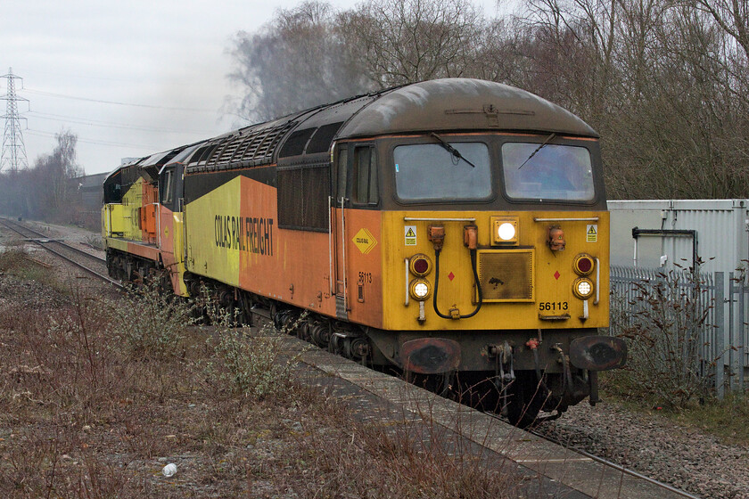 56113 & 70802, 08.30 Bescot Yard-Doncaster Works Wabtec (0Z75, 3E), Water Orton station 
 The second Colas Rail operation within a few minutes passes Water Orton station. With the Class 37 Cardiff Central to Derby test train having swept through 56113 leads 70802 as the 0Z75 08.30 Bescot to Doncaster Works light engine move. I am not sure as to why the Class 70 was being towed to Doncaster, perhaps it was part of a strategic move or if it was going for some sort of repair or other attention? Either way, it was good to see a locomotive dating from 1982 leading one over thirty years its junior! 
 Keywords: 56113 70802 08.30 Bescot Yard-Doncaster Works Wabtec 0Z75 Water Orton station Grid