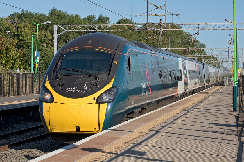 390151, VT 07.16 Liverpool Lime Street-London Euston (1A12, 4L), Bletchley station 
 390151 'Unknown Soldier' sweeps through Bletchley station working Avanti's 07.16 Liverpool to Euston service. This up train, and many others heading towards London, were well loaded in part due to the increased number of people heading to the capital to mourn the death of the Queen either to join the incredible queue to pass her lying in state or to bag their spot on the route of the funeral on Monday 19.09.22. 
 Keywords: 390151 07.16 Liverpool Lime Street-London Euston 1A12 Bletchley station Avanti West Coast Pendolino Unknown Soldier