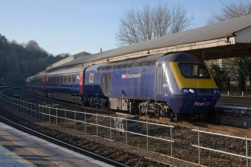 43171, GW 13.00 Bristol Temple Meads-London Paddington (1A18), Bath Spa station 
 The 1A18 13.00 Bristol to Paddington FGW HST service arrives at Bath Spa station. The train is being led by power car 43171 that was one of the last tranche of HSTs delivered during the summer of 1982 as part of set 254045 for use on the NE/SW route replacing locomotive-hauled services. This view of Bath station is set to change over the next couple of years with the arrival of electrification that will allow new high-speed electric trains to run between Paddington and Bristol. However, at the time of writing this is incredibly delayed so it may be a while yet until the venerable HSTs are replaced. 
 Keywords: 43171 13.00 Bristol Temple Meads-London Paddington 1A18 Bath Spa station First Great Western HST