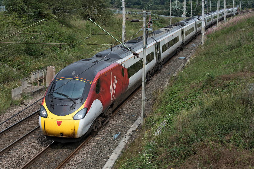 390107, VT 08.38 Liverpool Lime Street-London Euston (1A05, 27L), Milton Malsor SP738560 
 Due to engineering works on the Weedon loop of the southern WCML, all traffic was being diverted via Northampton. 390107 has just crossed the M1 motorway and is approaching Milton Malsor working the 08.38 Liverpool Lime Street to Euston. 
 Keywords: 390107 08.38 Liverpool Lime Street-London Euston 1A05 Milton Malsor SP738560