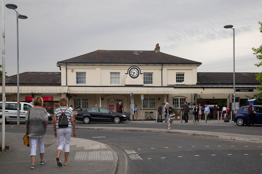 Frontage, Winchester station 
 The busy scene at the font of Winchester station taken on a stormy early evening. I took a very similar picture when I visited on New Year's Day in 1983. Instead of a black VW Passat parked at the front was my parent's delft blue Triumph Dolomite. Apart from a very different road layout, everything else was pretty much the same. I will upload the image and put a link here when I get around to scanning it! 
 Keywords: Frontage, Winchester station