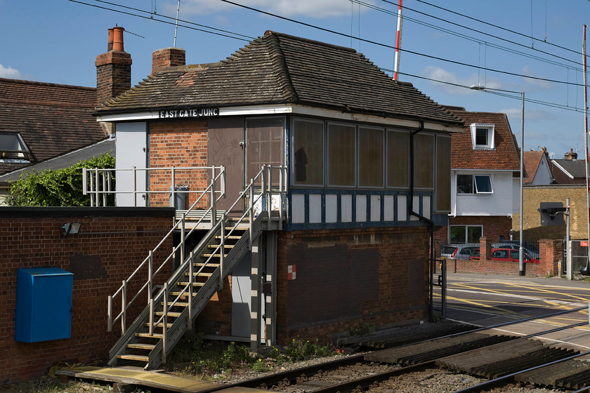 East Gate Junction signal box (LNER, 1924) 
 Due to its location within Colchester's conservation area, East Gate signal box cannot be demolished despite being out of use since 2009; no doubt much to the chagrin of Network Rail! The box was built by the LNER in 1924 to control the adjacent level crossing and the western junction of the short spur to Colchester Town station with its name coming from the road crossing the line rather than the junction itself! Notice the small extended gallery at the far end that enabled the signalmen to have a clear view of the bust road prior to lowering of the gates., a process that is now automated with the crossing monitored on a VDU in some signalling centre somewhere! 
 Keywords: East Gate Junction signal box LNER 1924