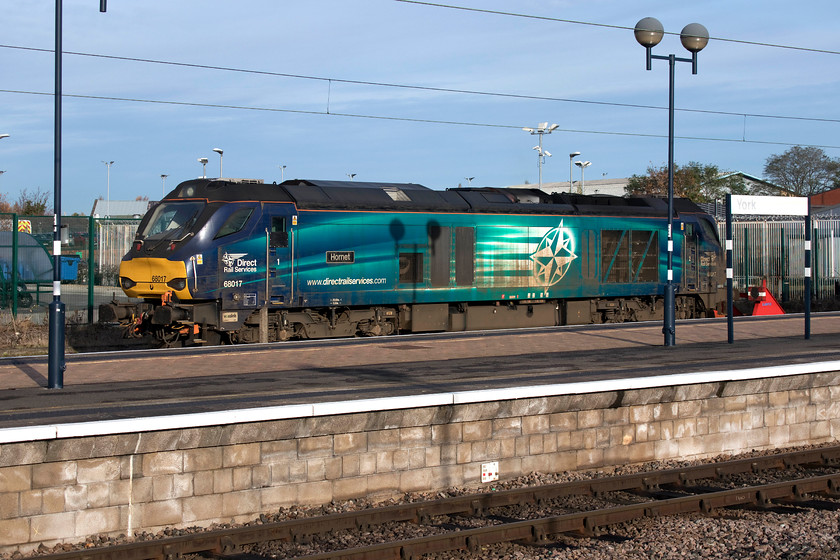 68017, stabled, York station 
 Looking a little grubby maybe as a result of undertaking some railhead treatemnt workings, 68017 'Hornet' sits stabled at York station. Whilst it was stabled, for some reason, its engines were on and idling that seemed very wasteful of resources and something that the railway could take a lead on with regard to lowering of its CO2 emissions. 
 Keywords: 68017 stabled York station class 68 Hornet