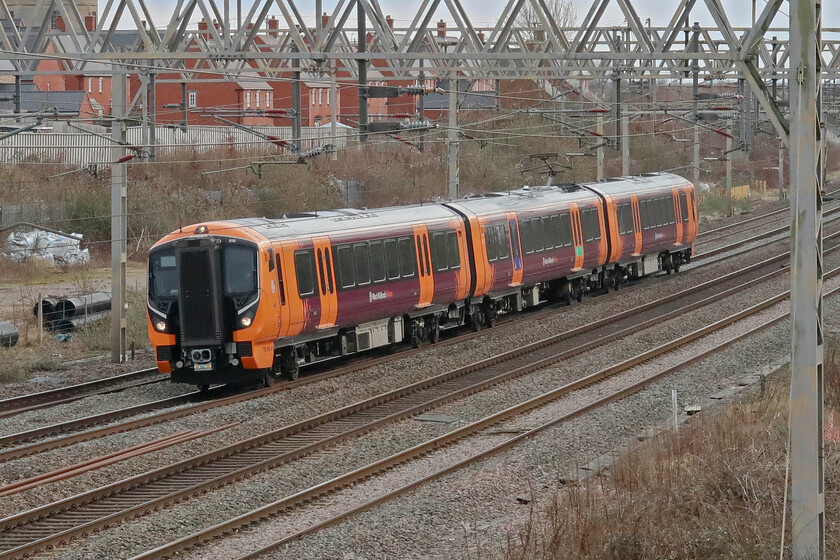 730016, 11.18 London Euston-Bletchley (5Q91, 31E), site of Roade station 
 Yet another Class 730 undergoes testing and mileage accumulation passing Roade. 730016 is working the 5Q91 11.18 Euston to Bletchley that will reverse at Northampton returning past this spot on the up slow line in about twenty minutes. The introduction to service of the Class 730s has been much delayed with a few now operating the Tring/Watford to and from Euston services since November 2023 but wearing the West Midlands Railway livery as seen here. 
 Keywords: 730016 11.18 London Euston-Bletchley 5Q91 site of Roade station West Midlands Trains