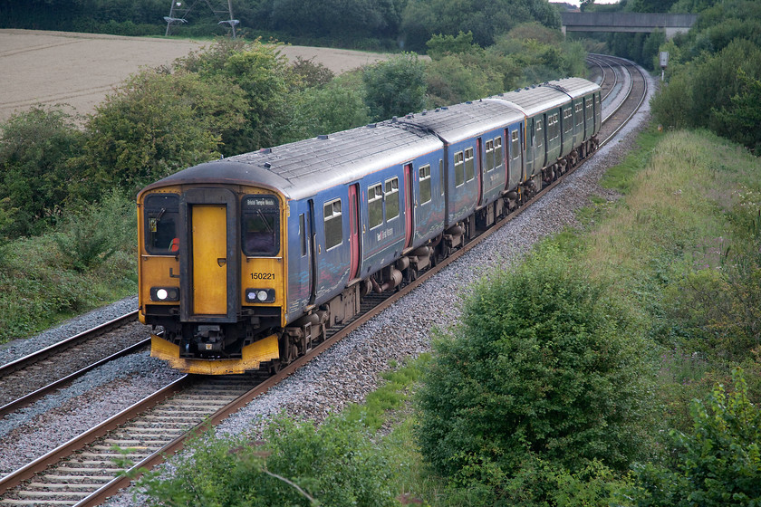 150221 & 150248, GW 16.58 Yeovil Pen Mill-Bristol Temple Meads (Cancelled Weymouth-Yeovil Pen Mill) (2V86, 1E), Berkley ST802494 
 150221 and 150248 past Berkley near Frome with the 16.58 Yeovil Pen Mill to Bristol Temple Meads. This train should have started from Weymouth, but for some reason, it was cancelled hence its revised start point. 
 Keywords: 150221 150248 2V86 Berkley ST802494