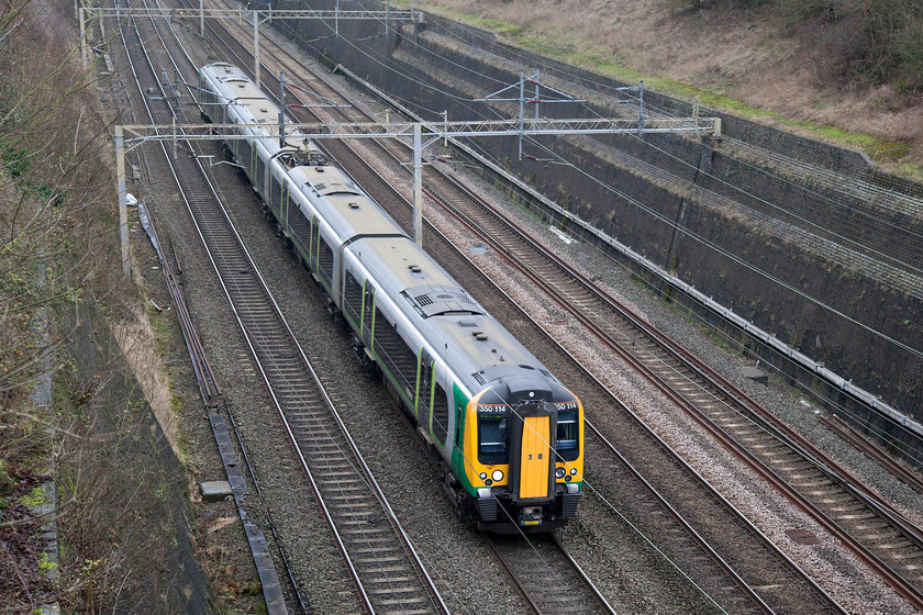 350114, LM 10.02 Crewe-London Euston (1U26), Roade Cutting 
 The 10.02 Crewe to London Euston passes through Roade Cutting on the up fast line formed of 350114. 
 Keywords: 350114 10.02 Crewe-London Euston 1U26 Roade Cutting