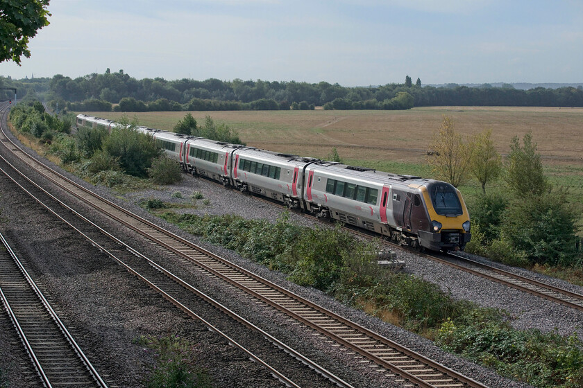 221120 & 220016, XC 07.30 Bournemouth-Manchester Piccadilly (1M30, 9L), Godstow bridge 
 By the time Andy and I reached Godstow bridge to the north of Oxford the clear blue skies of earlier have begun to cloud up. On the re-laid down relief line 221120 and 220016 work northwards on CrossCountry's 07.30 Bournemouth to Manchester Piccadilly service. The last time I visited this spot was back on a summer's day in 2018 with the new line yet to be commissioned, see.... https://www.ontheupfast.com/p/21936chg/23960748404/x800019-1p43-godstow-bridge The growth of the vegetation between the lines will soon become a problem at this location! 
 Keywords: 221120 220016 07.30 Bournemouth-Manchester Piccadilly 1M30 Godstow bridge CrossCountry Voyager